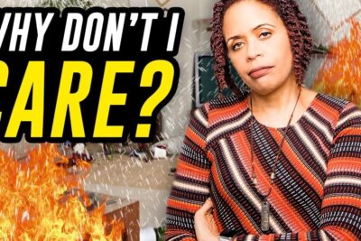 Woman with crossed arms and neutral expression in front of flames and a messy room, a redusere 4