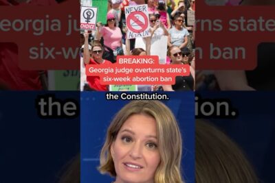 Protest crowd with signs and a television anchor covering a ruling about abortti on 2.