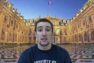 Young man speaking in front of an ornate palace courtyard backdrop illustrating absolutism ar.