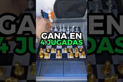 Hand moving a piece on a gold and silver chessboard with bold text overlay ajedrez juego 1.