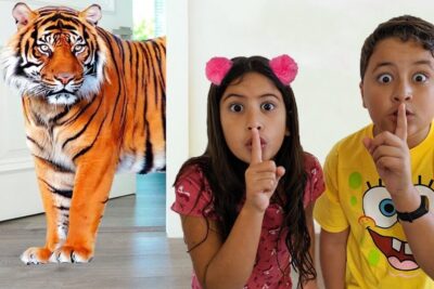 Two children shushing while a tiger stands in a doorway, animal estimacao 2.