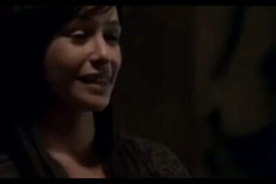 Smiling woman in a dimly lit room suggesting arguments halloween