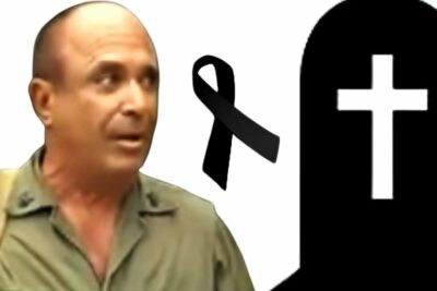 Man in olive shirt beside a tombstone silhouette and black mourning ribbon representing artistas cubanos 3