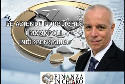 A suited presenter stands beside a cracked euro coin graphic symbolizing financial strain and aziende pubbliche in public finance.