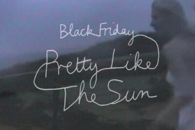 White handwritten script reading Black Friday and Pretty Like The Sun over a moody coastal dusk scene for black friday 26.