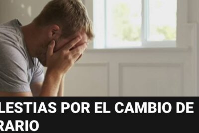 Stressed man holding his face indoors after cambio hora 2 time change