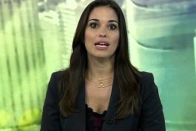 Female television presenter looking directly at camera in a studio setting suited for casamento homossexual 5 coverage.