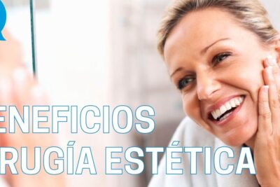Smiling middle-aged woman touching her cheek in front of a mirror promoting cirugia estetica 2.