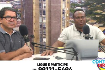 Two presenters in a studio at microphones during a contato direto broadcast