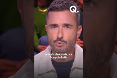 Close-up of a bearded man speaking on a studio set de mener 1