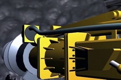 Close-up of a yellow drilling head used in der bergbau underground excavation.