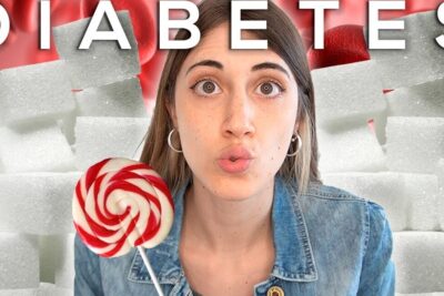 Young woman with a lollipop in front of sugar cubes illustrating diabetes tipo 1