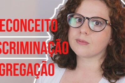 Close-up portrait of a woman wearing glasses next to large red Portuguese words about prejudice and discrimination discriminacao racial 1