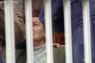 Elderly woman visible through white vertical bars, evocative image for doutrina parot coverage