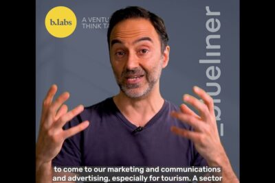 Man gesturing in a video frame discussing eettinen mainonta with a yellow b.labs logo and on-screen captions visible.