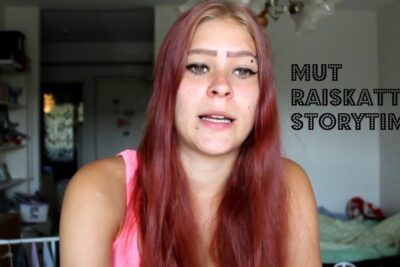 Candid close-up of a red-haired woman in a casual room setting with vlog-style text and the word eivat raskaaksi