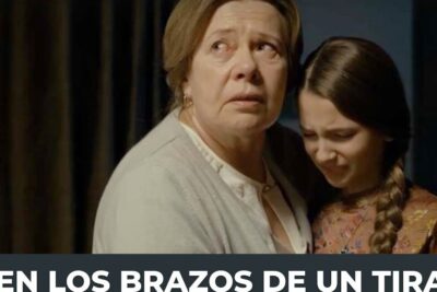 An elderly woman holds and comforts a frightened young girl in a dimly lit interior, el matrimonio 1.