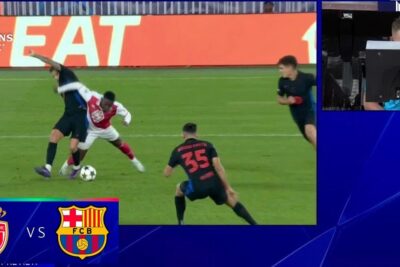 A contested tackle on the pitch shown beside a VAR monitor as officials review the incident labeled el var 1.