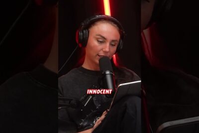 Podcast host in headphones speaking into a microphone in a studio about elinkautinen vankeus.