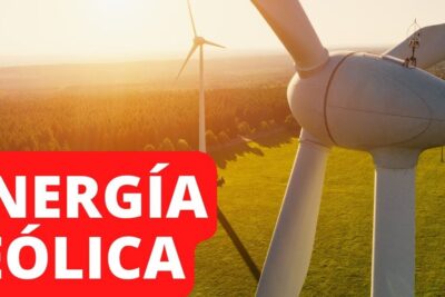 Close-up of wind turbine blades over green fields at sunset, energia eolica 6.