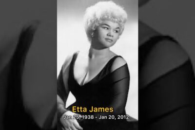 Vintage black-and-white studio portrait of a woman in an elegant off-shoulder dress evoking etta ihmisen