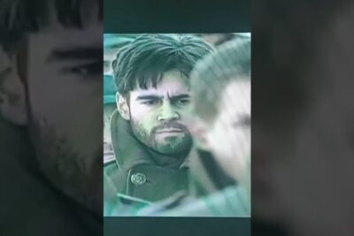 Close-up portrait of a bearded man in a heavy coat with a serious expression, etta vakivallan 1