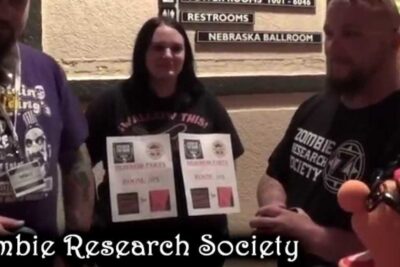 Group of convention attendees including etta zombit 1 holding award certificates in a hotel hallway