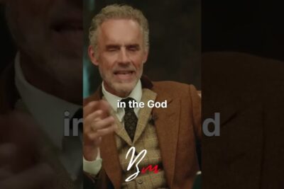Bearded man in a brown tweed jacket gesturing during a vertical clip labeled existence god 1.