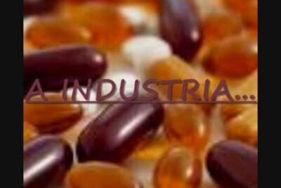 Close-up of amber and dark softgel capsules suggesting experimentacao humana and pharmaceutical testing
