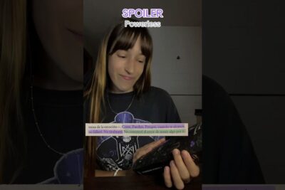 A smiling young reader holding a phone and reading a fantasy excerpt, highlighting a cozy fantasian lukeminen moment