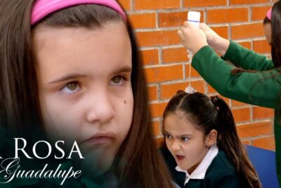 Young student having liquid poured on her hair by a classmate in a school setting, favor pelo 2.