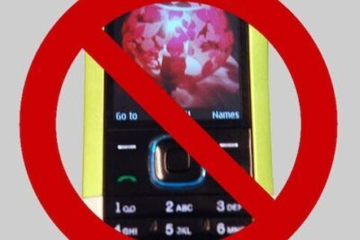 Red prohibition symbol over a basic mobile phone displaying an anti-texting message for att 60.