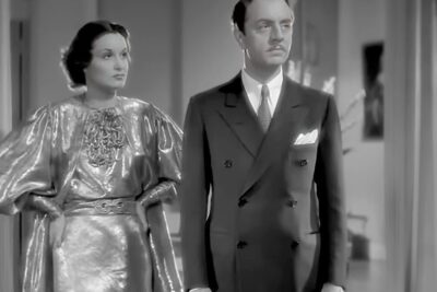 Elegant vintage couple in formal attire standing side by side, fordel favor