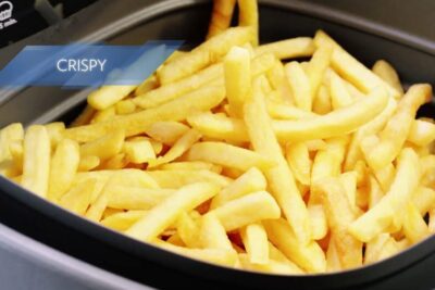 Crispy golden French fries in a freidora luft air fryer basket