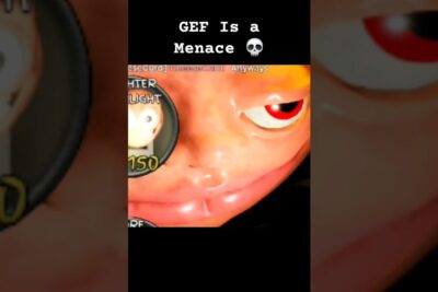 Close-up of a glossy orange animated face with a red half-closed eye, visible circular HUD and score, gef hle 2.