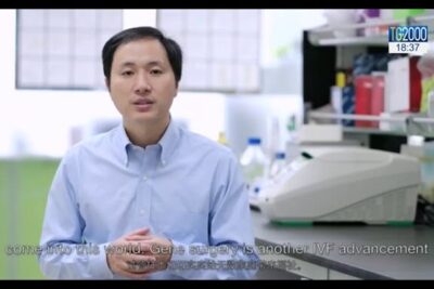 Scientist in a laboratory surrounded by instruments and reagents indicating geneticamente modificate research