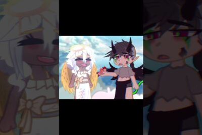 A gacha angel in white with golden wings and a horned demon holding a bloody heart in a gore holdning.