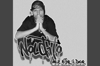 Black-and-white urban portrait of a seated figure with bandana and dripping graffiti text, hipotesis gaia 1.