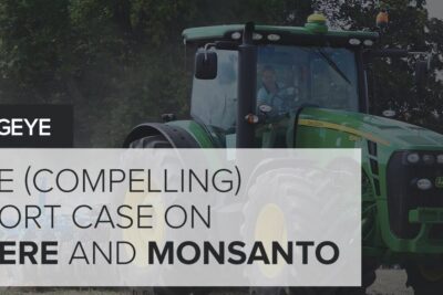 Green John Deere tractor in a field with overlay text referencing imod monsanto and agribusiness