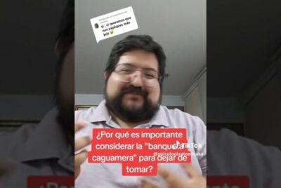 Bearded man with glasses speaking in a vertical video, captioned about why it's importante considerar 1 to stop drinking