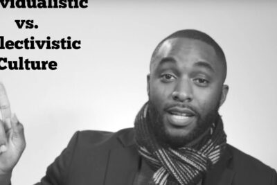 Portrait of a person pointing beside bold typographic text comparing individualism collectivism.