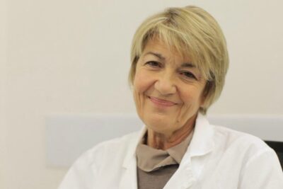 Smiling female doctor providing compassionate care related to interrompere gravidanza