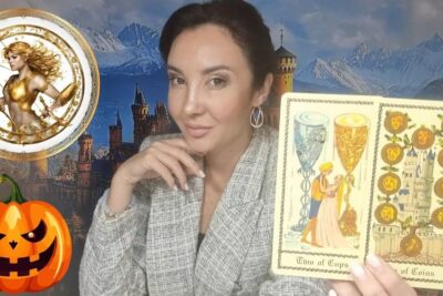 Woman holding two tarot cards in front of a castle backdrop with a jack-o'-lantern and a celestial emblem, jotkut saattavat 1.