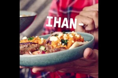 Handheld savory bowl with roasted vegetables, sliced meat, herbs and crumbled cheese juusto sisaltaa