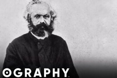Unidentified bearded 19th-century man in a dark coat portrait with 'BIOGRAPHY' overlay