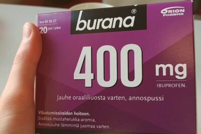 Purple Burana 400 mg ibuprofen box held in hand with laakarin maaraysta