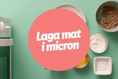 Microwave oven and bowls of flour, sugar, egg yolk and flakes arranged on a mint background with a pink circle labeled laga mat 1.