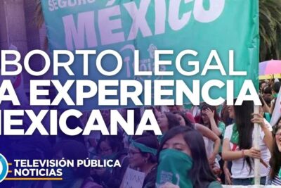 Crowd at a Mexican pro-choice rally with green bandanas and a large banner advocating legal abortion, legalizacion aborto 10.