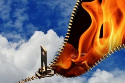 A metal zipper unzips a cloudy blue sky to expose bright orange flames, libero arbitrio 1.