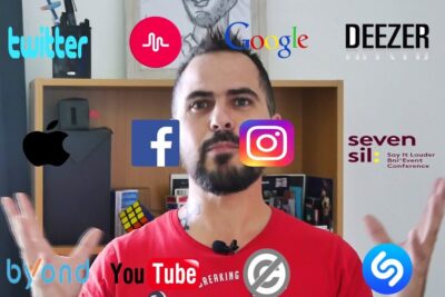 A bearded man in a red shirt gestures in front of a bookshelf with floating social media and music app logos around him, illustrating platform options liberte choix 2.